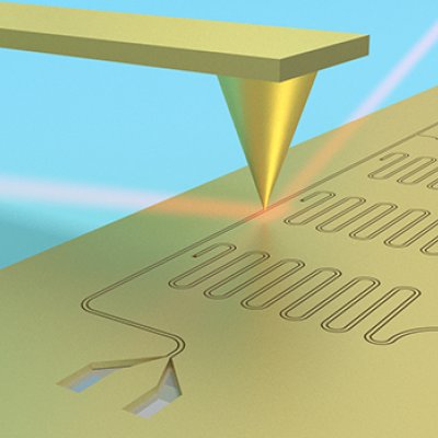 Schematic of a superconducting circuit [thin black lines] on a silicon chip [yellow base], being imaged using terahertz scanning near-field microscopy [red beam focused into yellow tip].